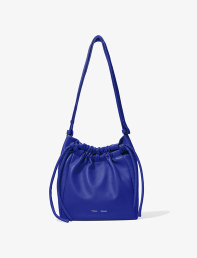 Front image of Drawstring Pouch in COBALT with strap extended
