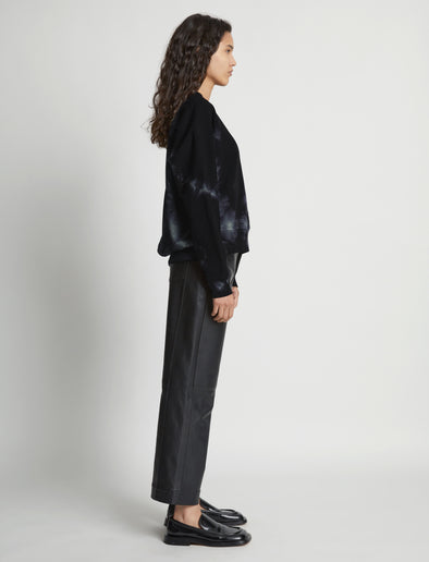 Side image of model wearing Tie Dye Sweatshirt in black/jade