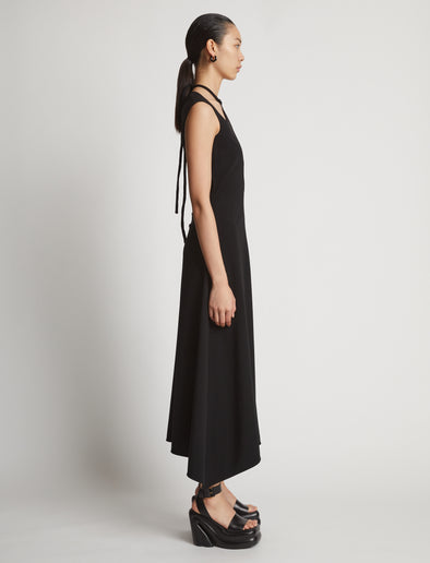 Side image of model wearing Matte Viscose Crepe Dress in black