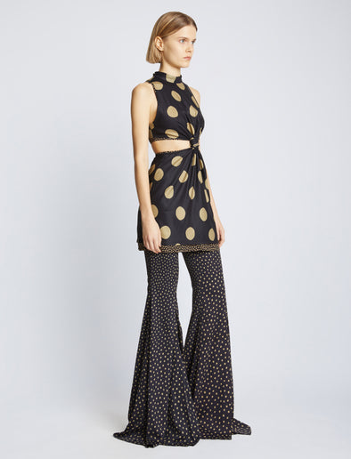 Side image of model wearing Printed Dot Cady Top in khaki multi