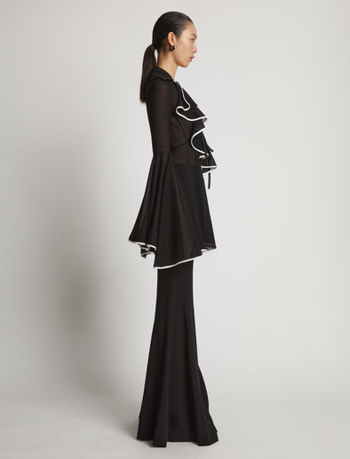 Side image of model wearing Solid Mesh Ruffle Shirt in black