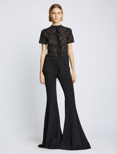 Front image of model wearing Stretch Lace Top in black