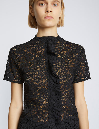Detail image of model wearing Stretch Lace Top in black