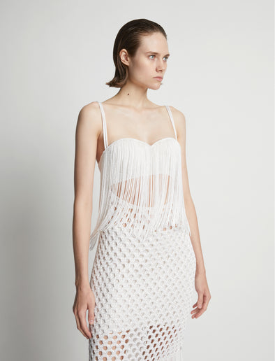 Detail image of model wearing Lacquered Knit Dress in white