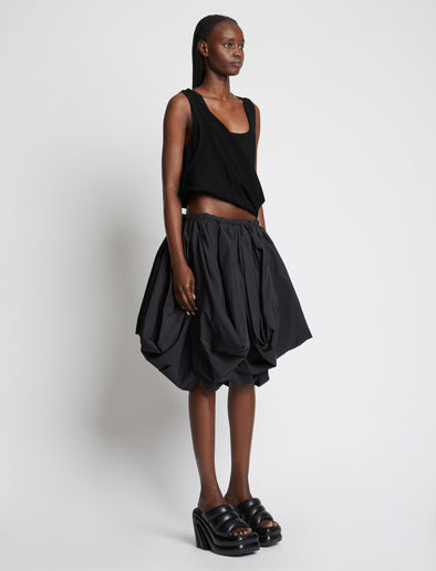 Side image of model wearing Viscose Knit Top in black