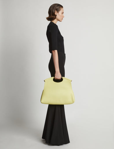 Image of model carrying Bar Bag in LEMONGRASS