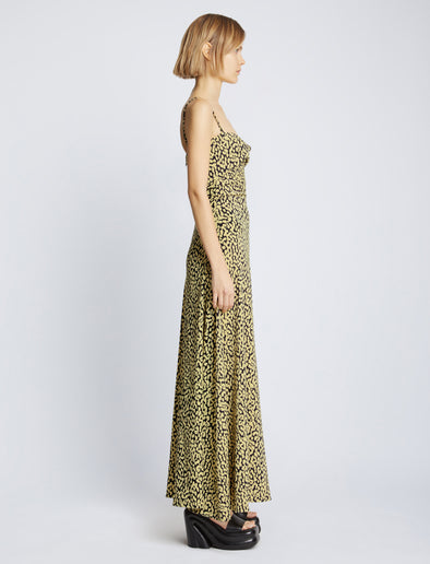 Side image of model wearing Printed Leopard Tank Dress in butter multi