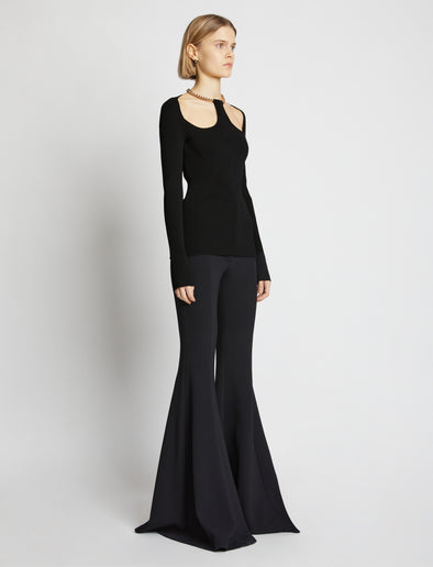 Side image of model wearing Chain Detail Viscose Knit Sweater in black