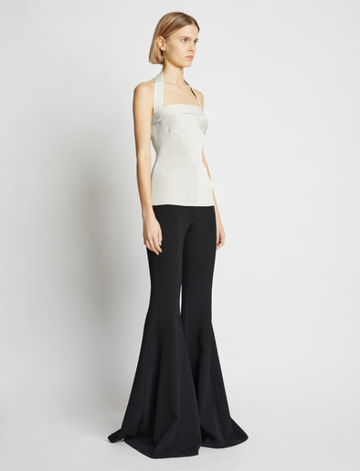 Side image of model wearing Viscose Knit Halter Top in off white