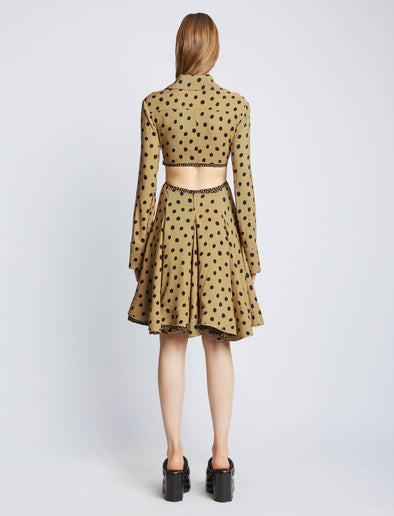 Back image of model wearing Printed Dot Cut Out Shirt Dress in khaki black