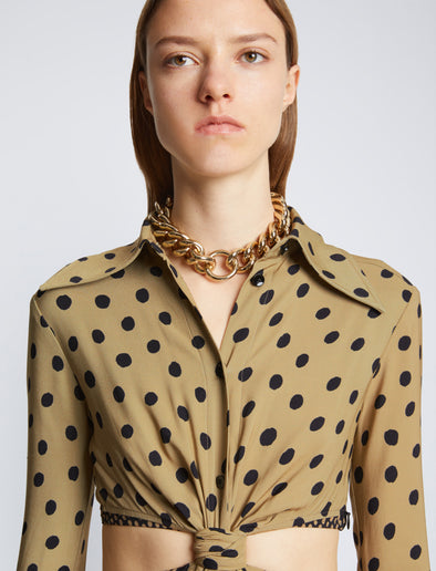 Detail image of model wearing Printed Dot Cut Out Shirt Dress in khaki black