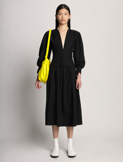 Image of model wearing Drawstring Pouch in CANARY YELLOW