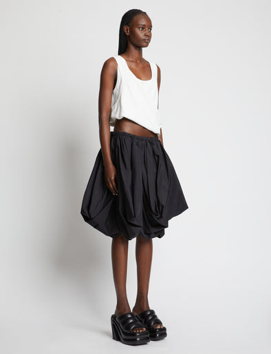 Side image of model wearing Viscose Knit Top in white