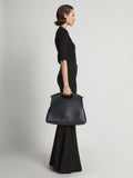 Image of model carrying Bar Bag in BLACK