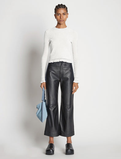 Front image of model wearing Cropped Turtleneck Chenille Sweater in off white