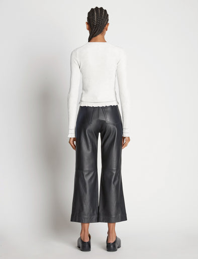 Back image of model wearing Cropped Turtleneck Chenille Sweater in off white