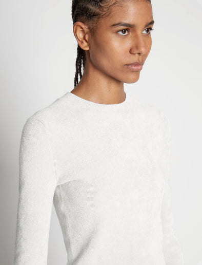 Detail image of model wearing Cropped Turtleneck Chenille Sweater in off white