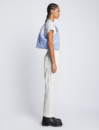 Image of model carrying Minetta Bag in PERIWINKLE on shoulder