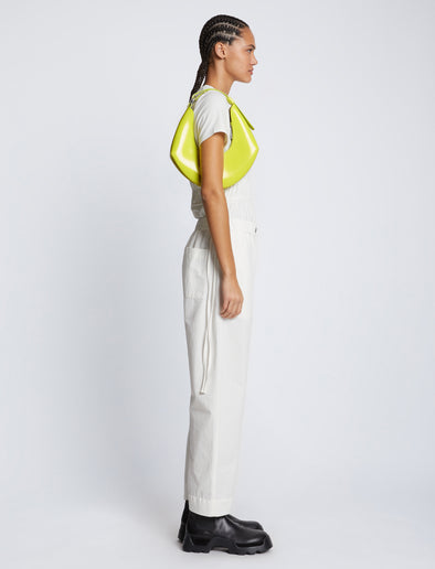 Image of model carrying Small Chrystie Bag in LIME on shoulder