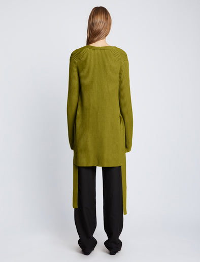 Back full length image of model wearing Ribbed Cotton Relaxed Cardigan in LEAF