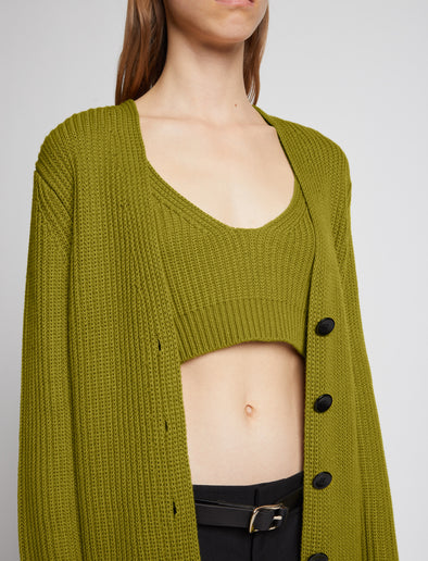 Detail image of model wearing Ribbed Cotton Relaxed Cardigan in LEAF