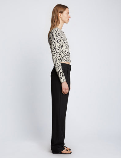 Side full length image of model wearing Animal Jacquard Cardigan in BEIGE/BLACK