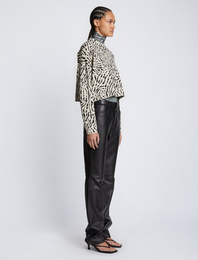 Side full length image of model wearing Animal Jacquard Sweater in BEIGE/BLACK