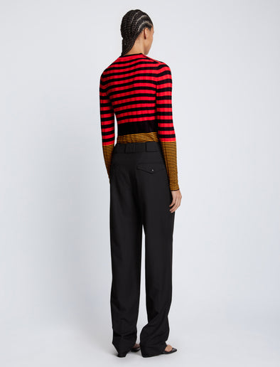 Back full length image of model wearing Slinky Stripe Long Sleeve Sweater in CHERRY/GOLDEN ROD/BLACK