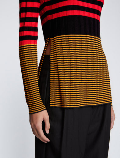Detail image of model wearing Slinky Stripe Long Sleeve Sweater in CHERRY/GOLDEN ROD/BLACK