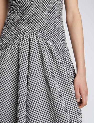Detail image of model wearing Gingham Seersucker Smocked Dress in OFF WHITE/BLACK