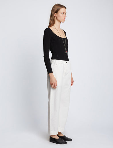 Side full length image of model wearing Solid Cotton Linen Easy Pants in OFF WHITE