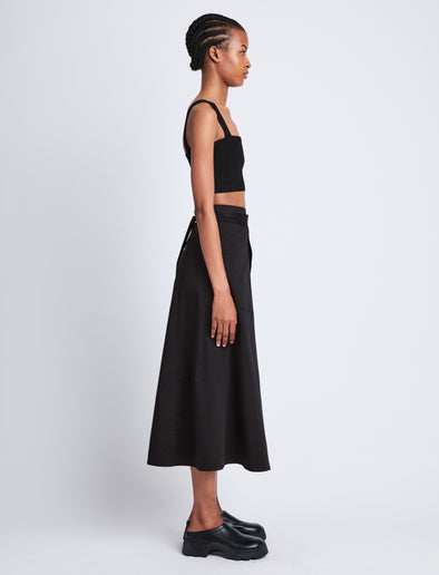 Side full length image of model wearing Soft Poplin Wrap Skirt in BLACK