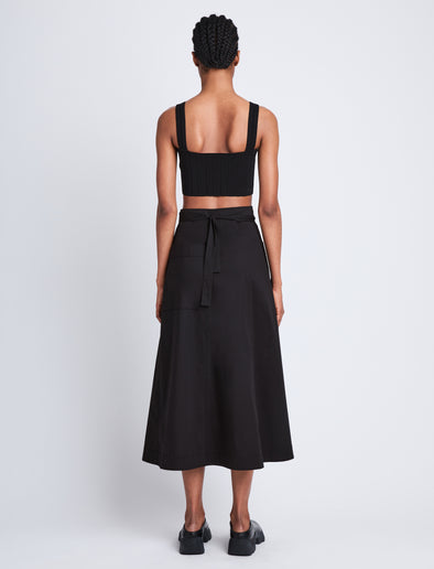 Back full length image of model wearing Soft Poplin Wrap Skirt in BLACK
