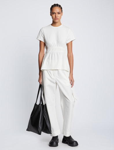 Front full length image of model wearing Ruched Side Tie T-Shirt in OFF WHITE