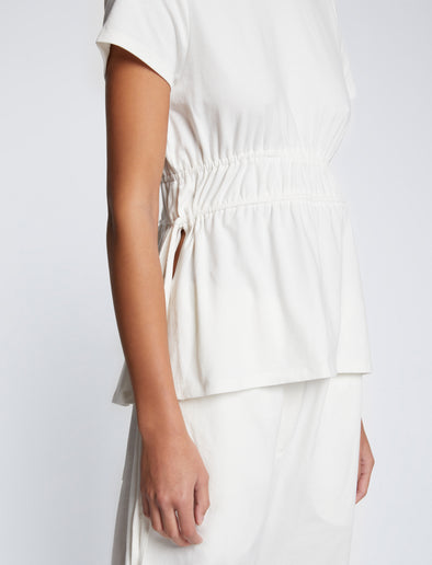Detail image of model wearing Ruched Side Tie T-Shirt in OFF WHITE
