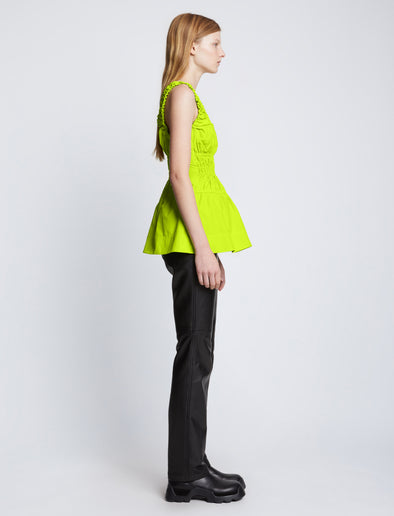 Side full length image of model wearing Poplin Gathered Tank Top in GREEN APPLE