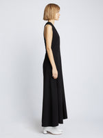 Side full length image of model wearing Matte Crepe Twist Back V-Neck Dress in BLACK