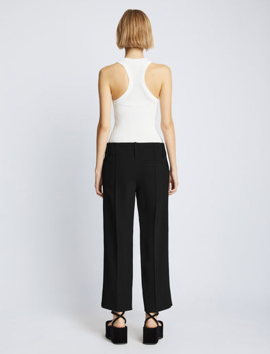 Back full length image of model wearing Bi-Stretch Crepe Cropped Pants in BLACK