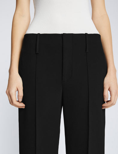 Detail image of model wearing Bi-Stretch Crepe Cropped Pants in BLACK