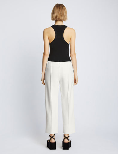 Back full length image of model wearing Bi-Stretch Crepe Cropped Pants in WHITE