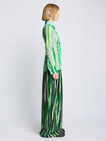 Side full length image of model wearing Painted Stripe Matte Jersey Shirt in BLUE/GREEN MULTI