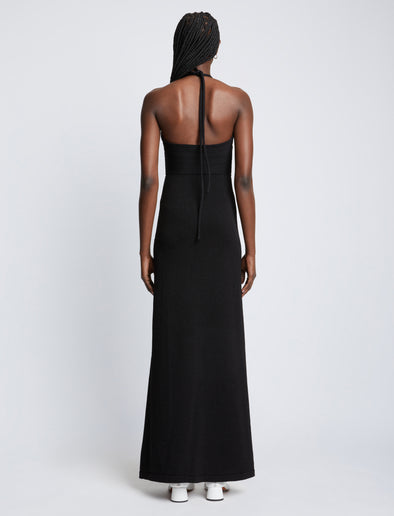 Back full length image of model wearing Textured Cotton Knit Halter Dress in BLACK