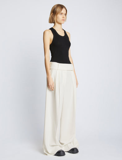 Side full length image of model wearing Matte Viscose Crepe Pants in WHITE