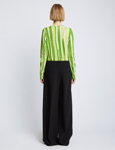 Back full length image of model wearing Painted Stripe T-Shirt in GREEN MULTI