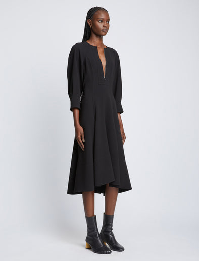 Side full length image of model wearing Matte Viscose Crepe Dress in BLACK