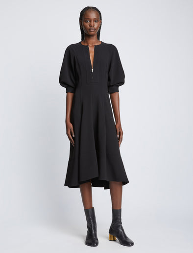 Front full length image of model wearing Matte Viscose Crepe Dress in BLACK with sleeves rolled up
