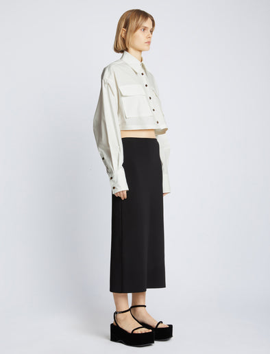 Side full length image of model wearing Eco Poplin Shirt in WHITE