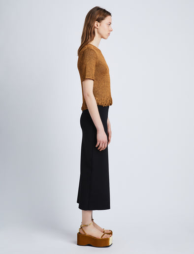 Side full length image of model wearing Ribbon Crochet Fringe Top in SADDLE