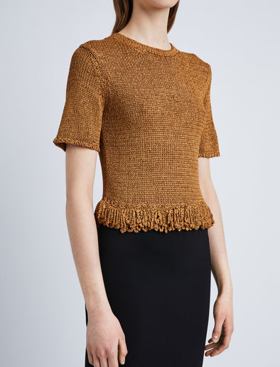 Detail image of model wearing Ribbon Crochet Fringe Top in SADDLE