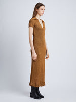 Side full length image of model wearing Ribbon Crochet Fringe Dress in SADDLE